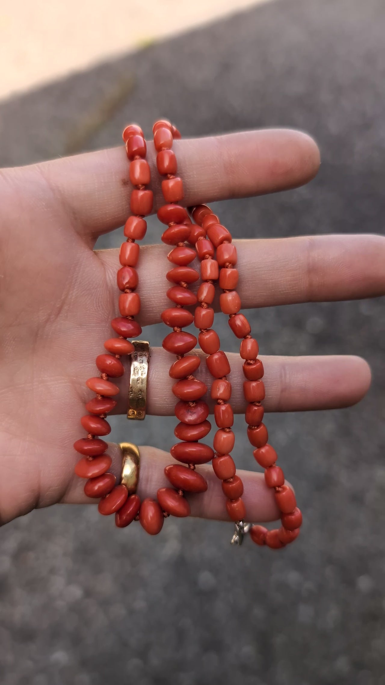 Coral Necklace in Hand