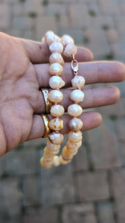 Skull Pearl Necklace held in hand